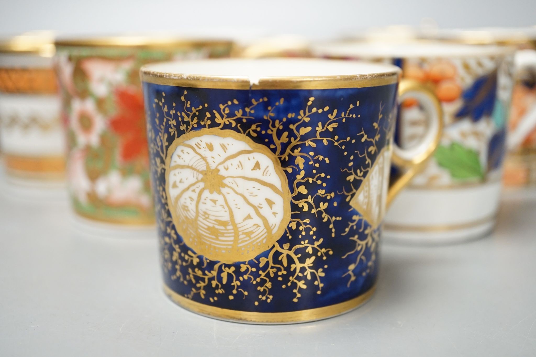 Ten various early 19th century English porcelain coffee cans